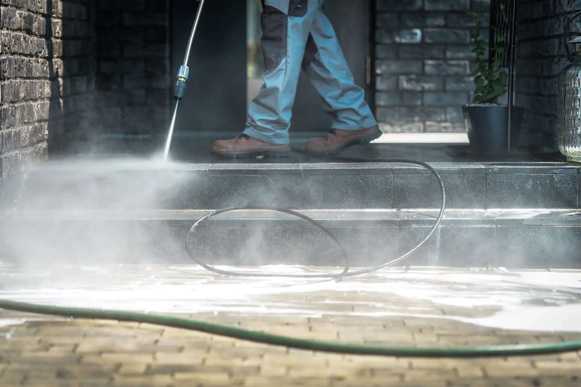 Professional power washing brick steps and a residential walkway